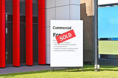 Business for sale with sold sign in front