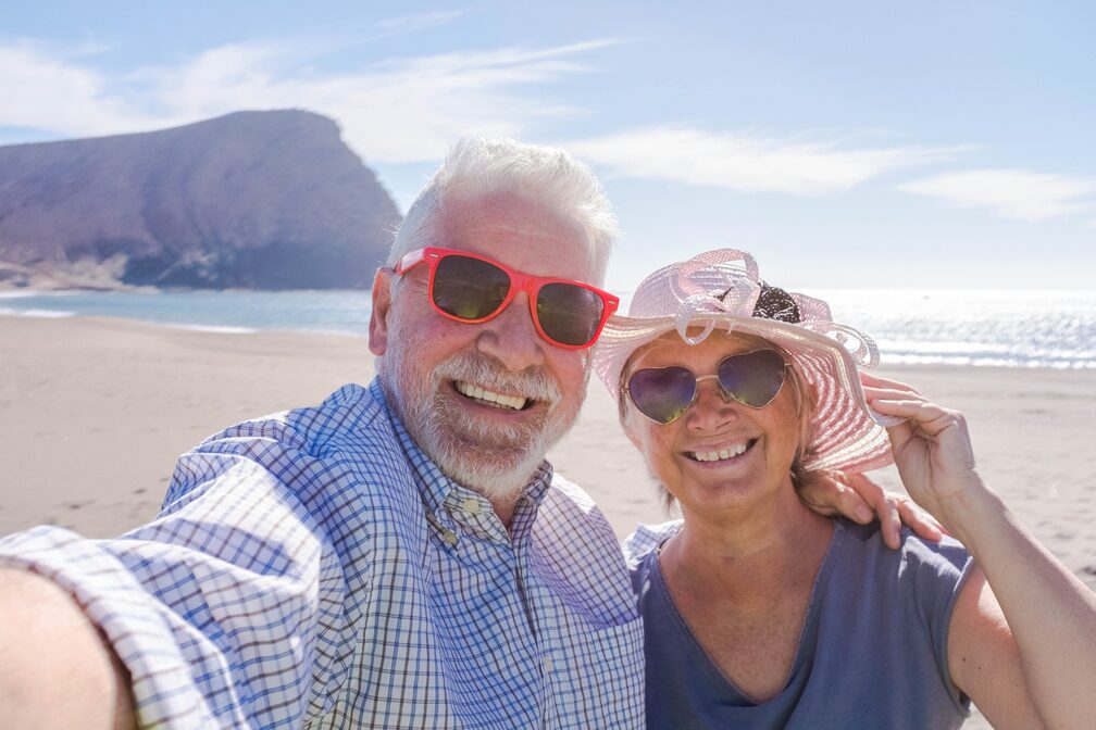 senior couple enjoying themselves on the beach