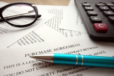 Pen on purchase agreement
