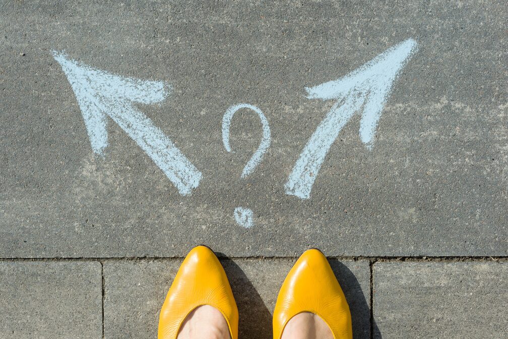 arrows in two directions with woman yellow shoes
